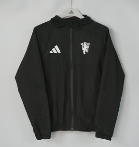 MANCHESTER UNITED 2026/27 HOODED WINDBREAKER JACKET - Black - front