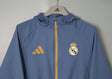 REAL MADRID 2026/27 HOODED WINDBREAKER JACKET - Blue Grey - front