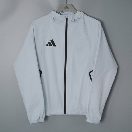 ADIDAS 2026/27 CORTAVIENTOS CON CAPUCHA - Gris Claro